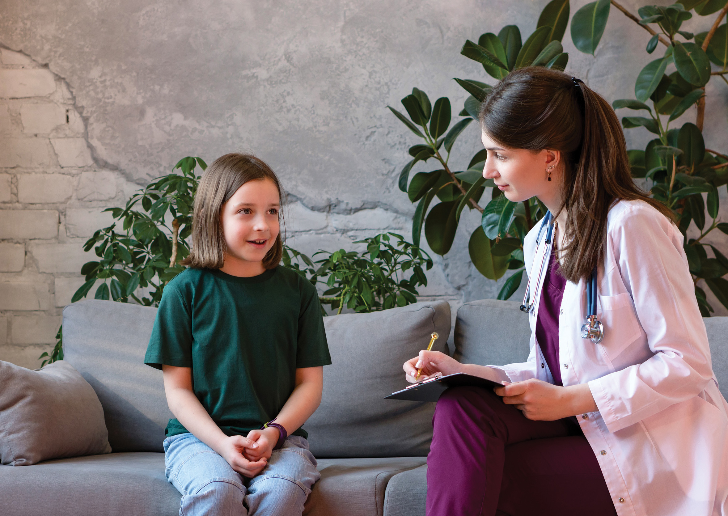 a nurse practitioner conducts an urgent care visit with a sick child